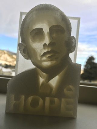 3D printed tactile lithophanes of President Barack Obama. One image depicting a
          side view and one showing the front view