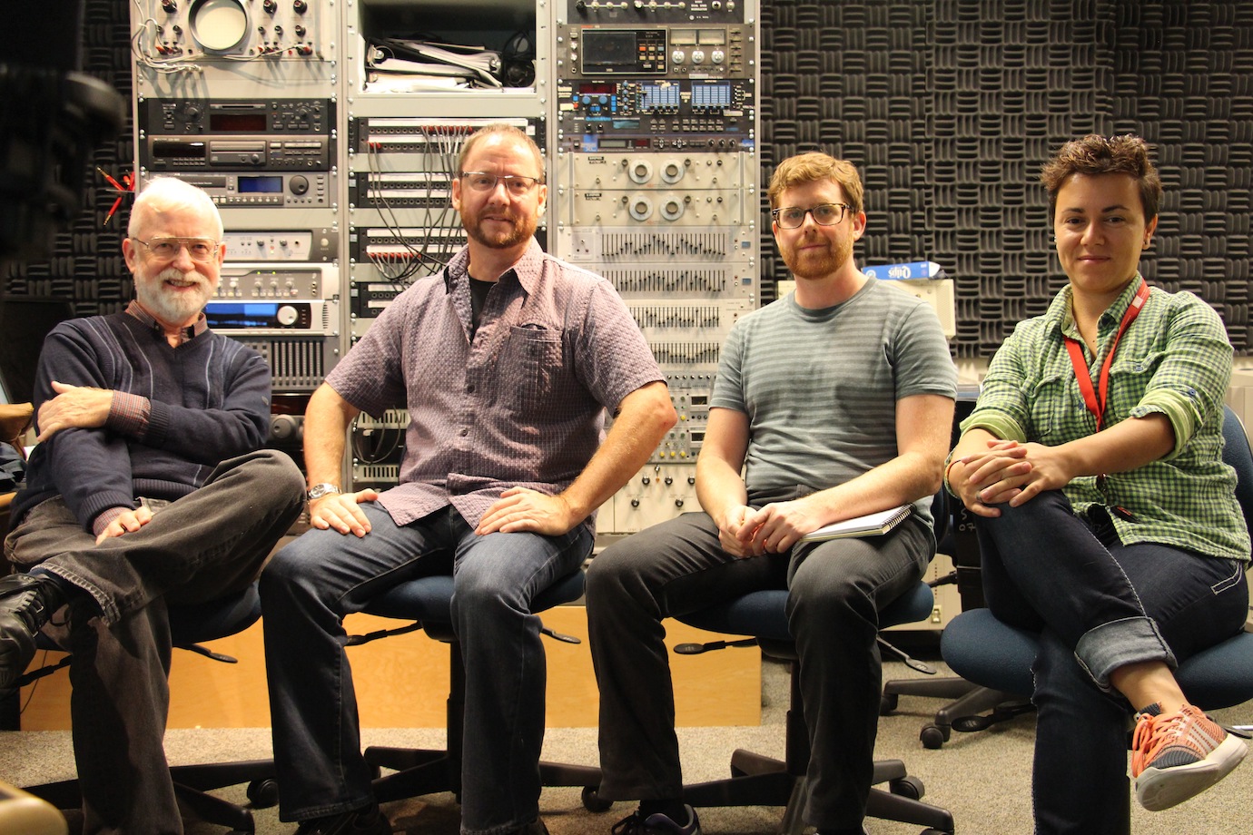 4 people sitting in chars in front of a panel of audio equipment, in a sound studio: Barry Truax, David Murphy, Paul Bennett, and Milena Droumeva