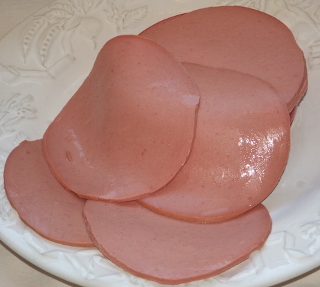 photo of slimey sliced bologna sausage