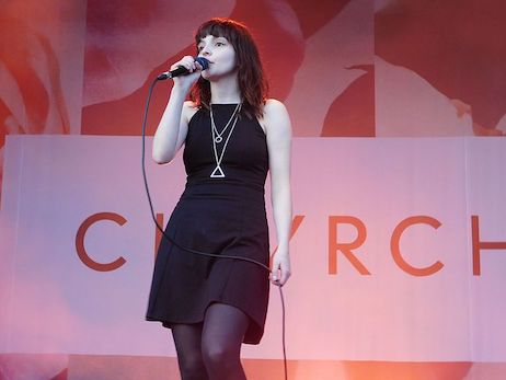 photo of Lauren Mayberry singing on stage