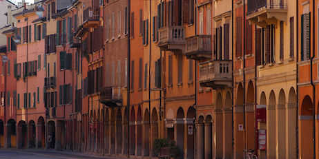 sunset photo of charming street scene in Bologna, Italy