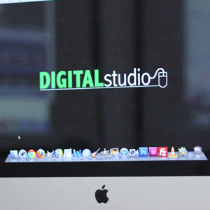 A MAC monitor has the words "Digital Studio" on display. 