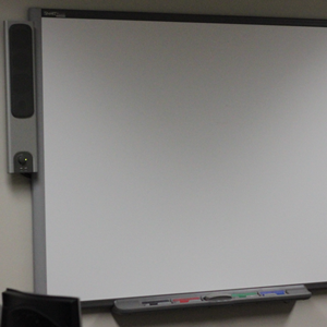A Smart Board is installed on a wall.