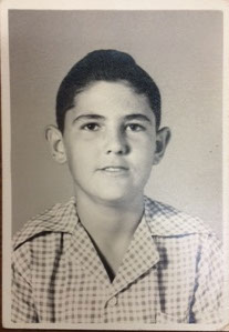 A black and white school picture of Glen as an early adolescent, possibly 12 or 13.