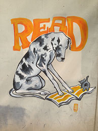 Graffiti: READ written over a painting of a large hound holding down an opened magazine with both paws.