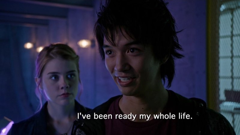 Ren is staring with a confident smile on his face as open captions appear in a bright white font, "I've been ready my whole life."