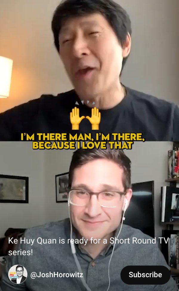 A vertical video shows Ke Huy Quan at the top and Josh Horowitz at the bottom of the screen. Quan seems to be in at home and Horowitz is in a living room. Open captions in the middle of the frame between the two screens read "I'm there man, I'm there because I love that." Above the captions is a high-five emoji.