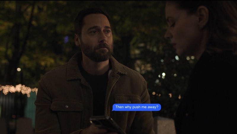 Max and Elizabeth, in regular clothes, are seated outside the hospital at night. Max is holding a phone to Elizabeth. A blue bubble appears near the phone that reads, "Then why push me away?"