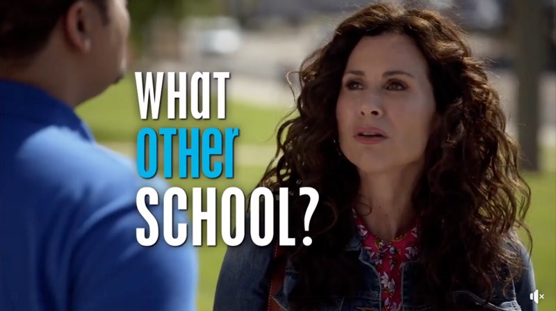 JJ's mother responds to Kenneth with the capitalized open captions saying, "What other school?" The first and last words are white while “other” is blue.