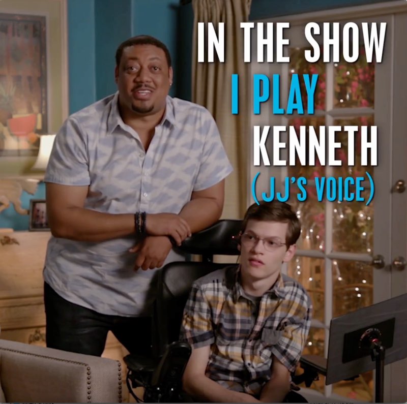 The same scene shows captions, “"In the show I play Kenneth (JJ's voice)." The first and third lines are in white while the second and fourth lines are in blue text.
