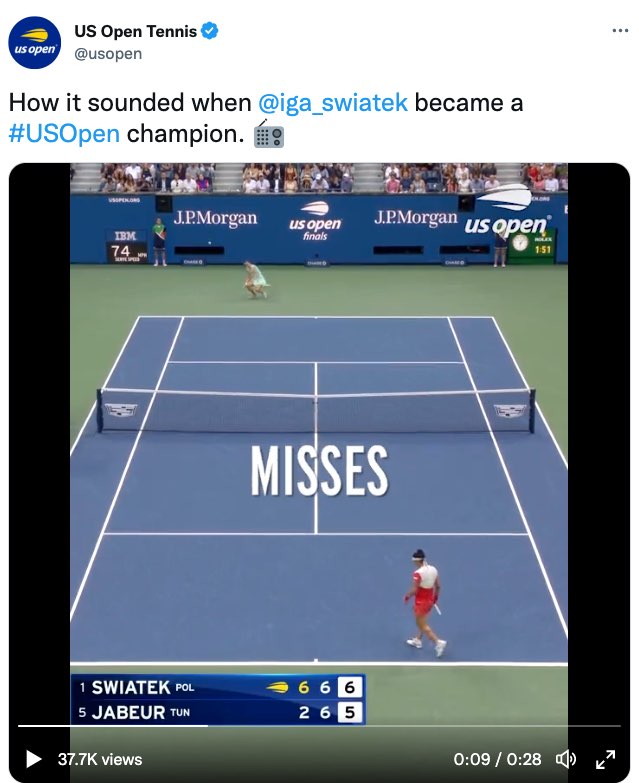 A tweet by US Open Tennis. The tweet reads, "How it sounded when @iga_swiatek became a #US Open champion." The tweet ends with an emoji of a radio. The tweet includes a video of Swiatek and Jabeur playing on a tennis court in the third set with Swiatek leading 6 games to 5. This image shows a moment in the video with large open captions over the middle of the court. The captions read, "misses."
