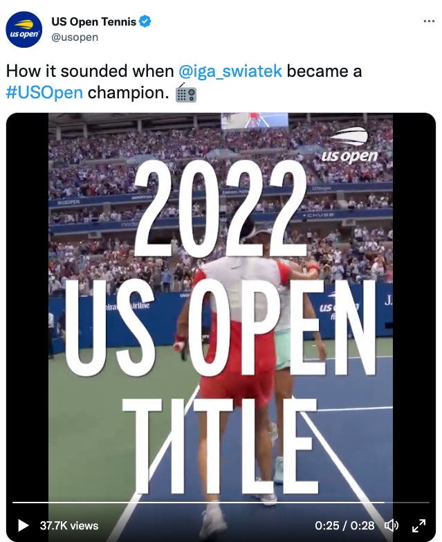 A tweet by US Open Tennis. The tweet reads, "How it sounded when @iga_swiatek became a #US Open champion." The tweet ends with an emoji of a radio. The tweet includes a video that now shows Swiatek and Jabeur walking towards each other on court and starting to hug. Extra large open captions read, "2022 US Open Title."
